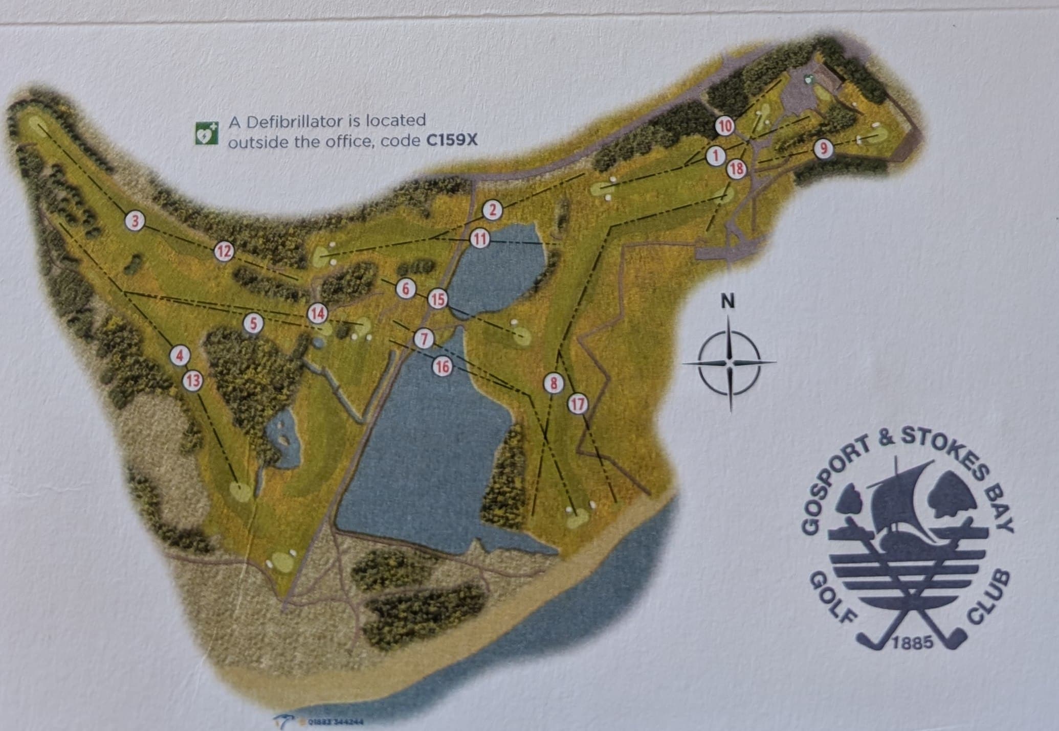 Illustrated course map from the scorecard: all 18 numbered tees around the lakes, with the 1st, 9th, 10th and 18th meeting by the clubhouse at the north-east corner, and a compass rose showing north